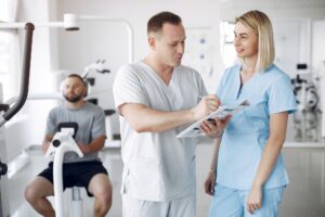 Doctor with a patient in physiotherapy clinic